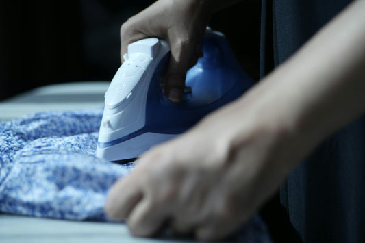 a-person-ironing-bold-italia-suit