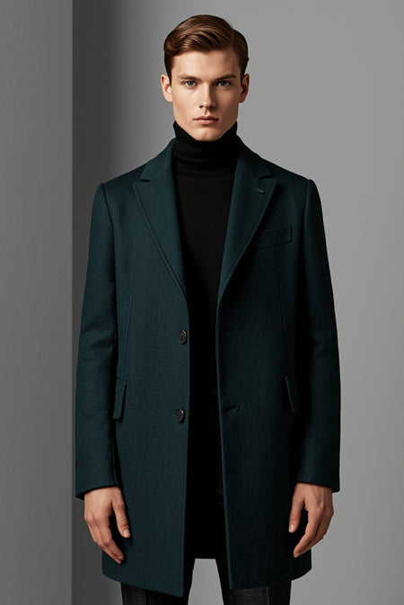 Man wearing dark green overcoat with black turtleneck minimalist winter outfit