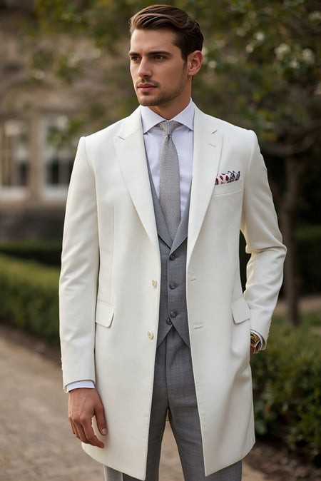 Mens ivory overcoat layered over grey three-piece suit with tie and pocket square – elegant tailored formal outfit