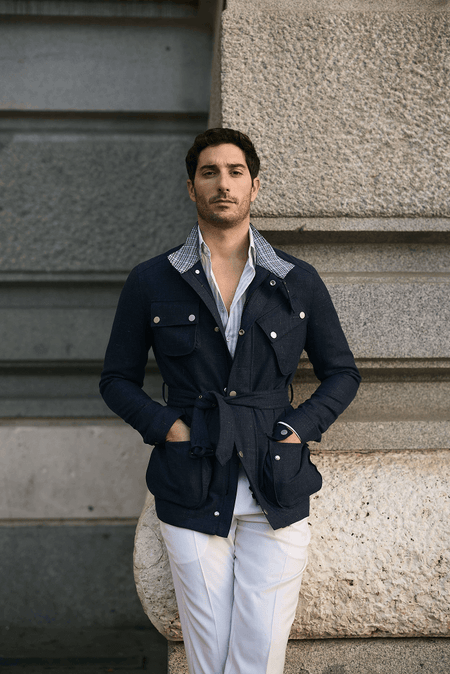 Mens navy safari jacket with white shirt and tailored white dress pants – modern luxury smart casual outfit
