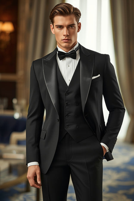 Man wearing black tuxedo with waistcoat and bow tie formal black tie outfit