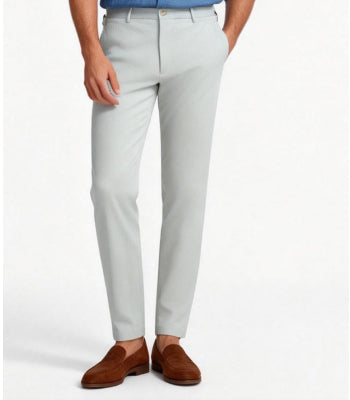 Mens light grey tailored dress pants styled with brown loafers – modern slim fit slacks