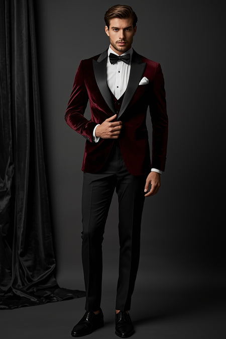 Man wearing burgundy velvet tuxedo jacket with black lapels formal evening outfit