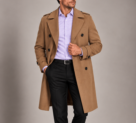 Man wearing a camel double-breasted overcoat with a lavender dress shirt and black trousers for a polished smart-casual look.