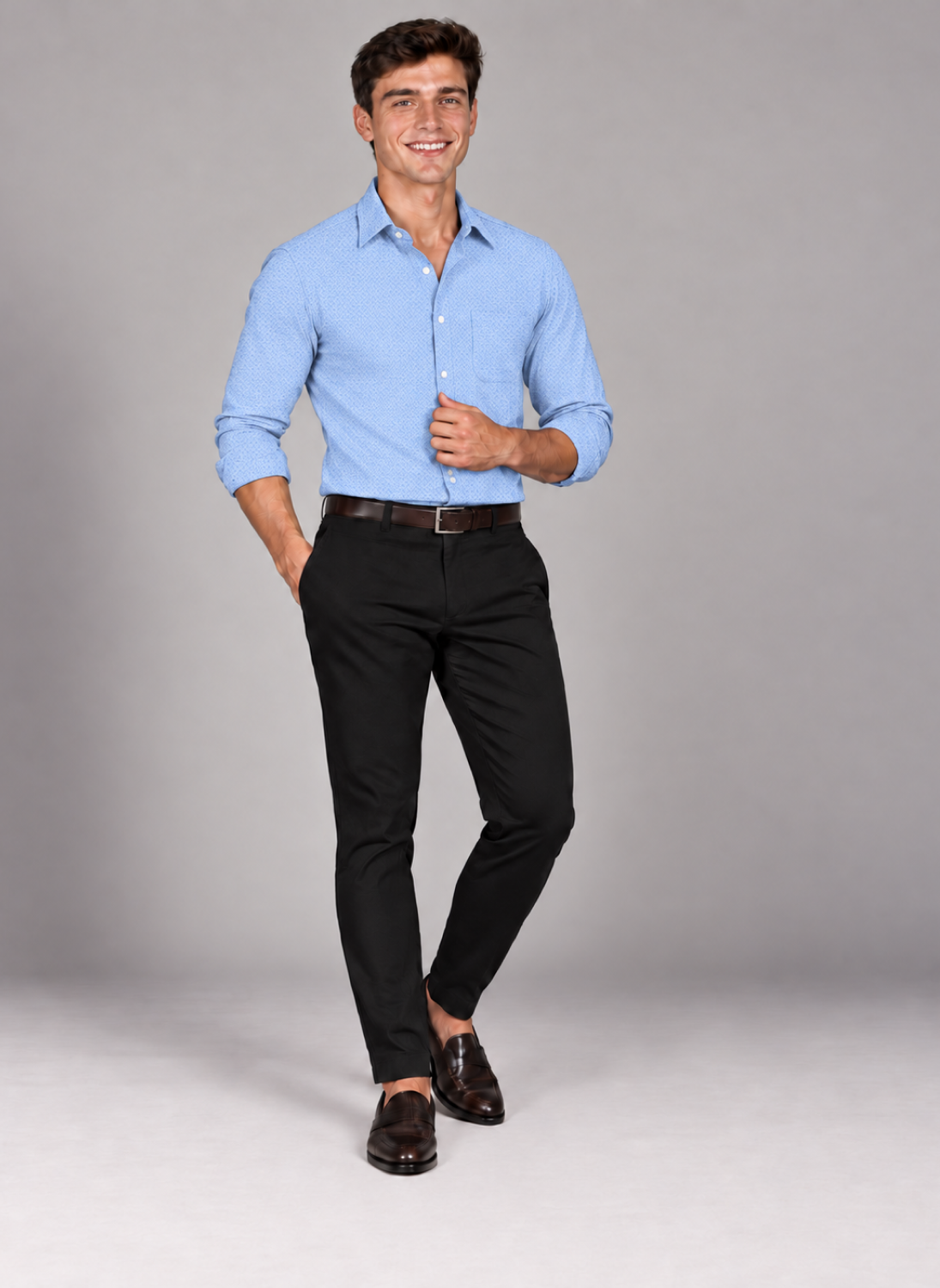Man wearing a men's signature light blue jacquard dress shirt with black trousers and brown loafers.