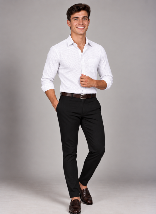 Man wearing a signature crisp white plaid shirt with black trousers and brown loafers for a polished smart-casual look.
