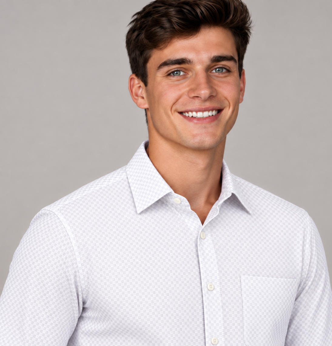 Close-up of a men's signature crisp white plaid dress shirt featuring a subtle check pattern and classic collar.