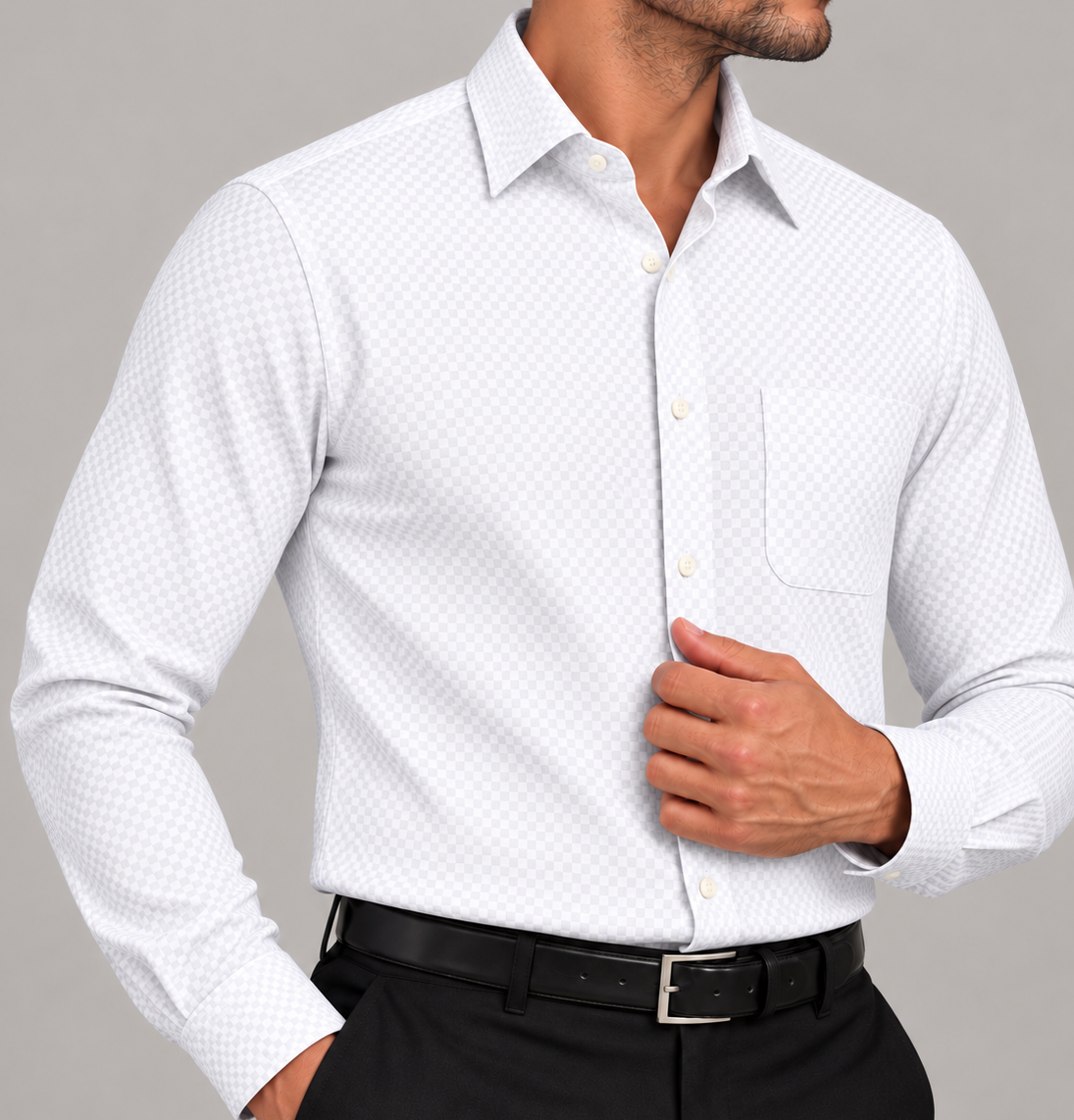 Close-up of a men's signature crisp white plaid shirt with a subtle check pattern, classic collar, and chest pocket.