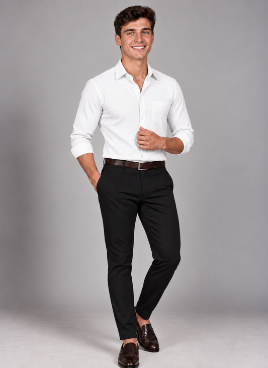 Man wearing a signature white plaid dress shirt with black trousers and brown loafers for a polished smart-casual look.