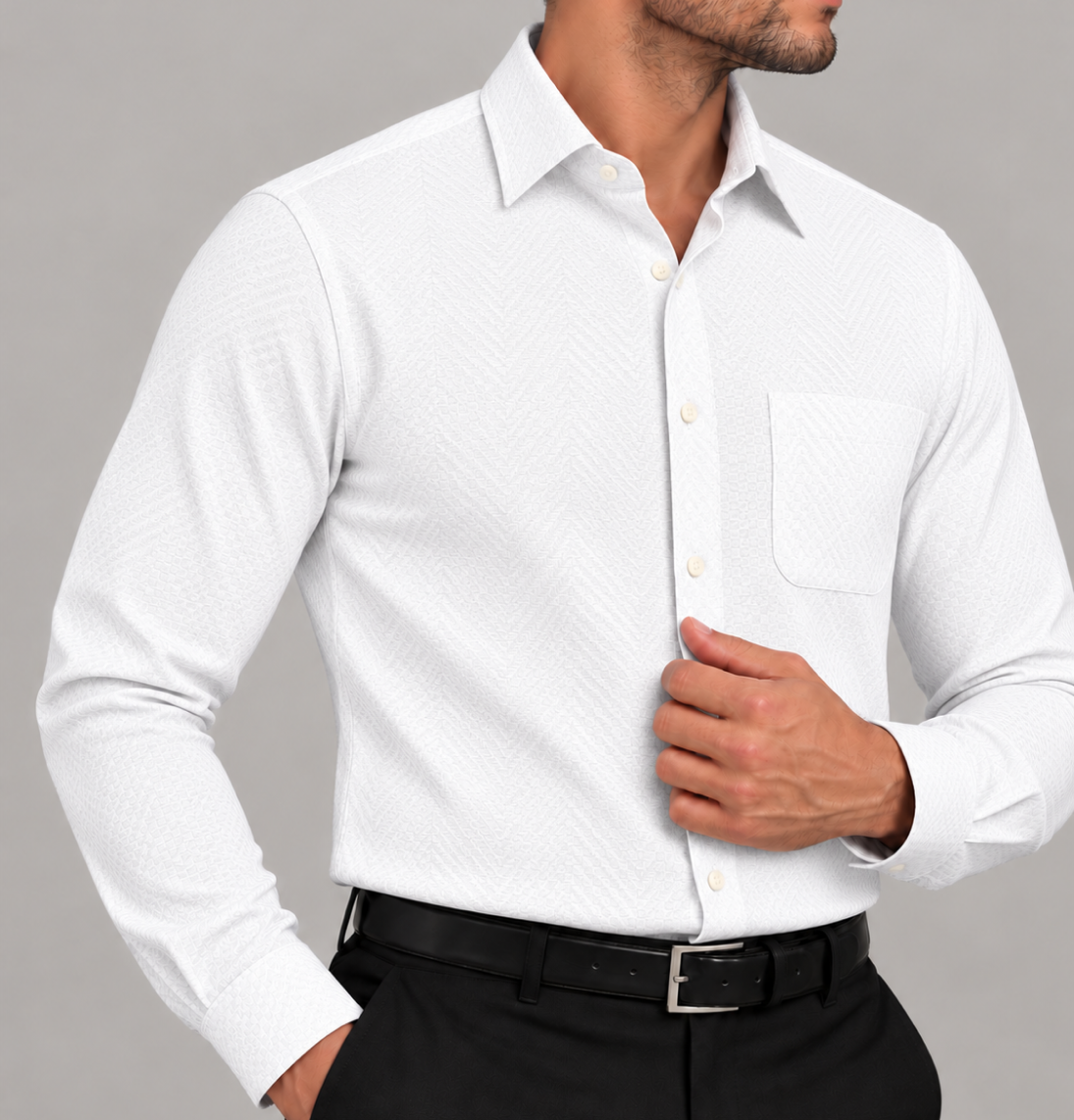 Close-up of a men's signature white plaid dress shirt with a subtle textured pattern and chest pocket.