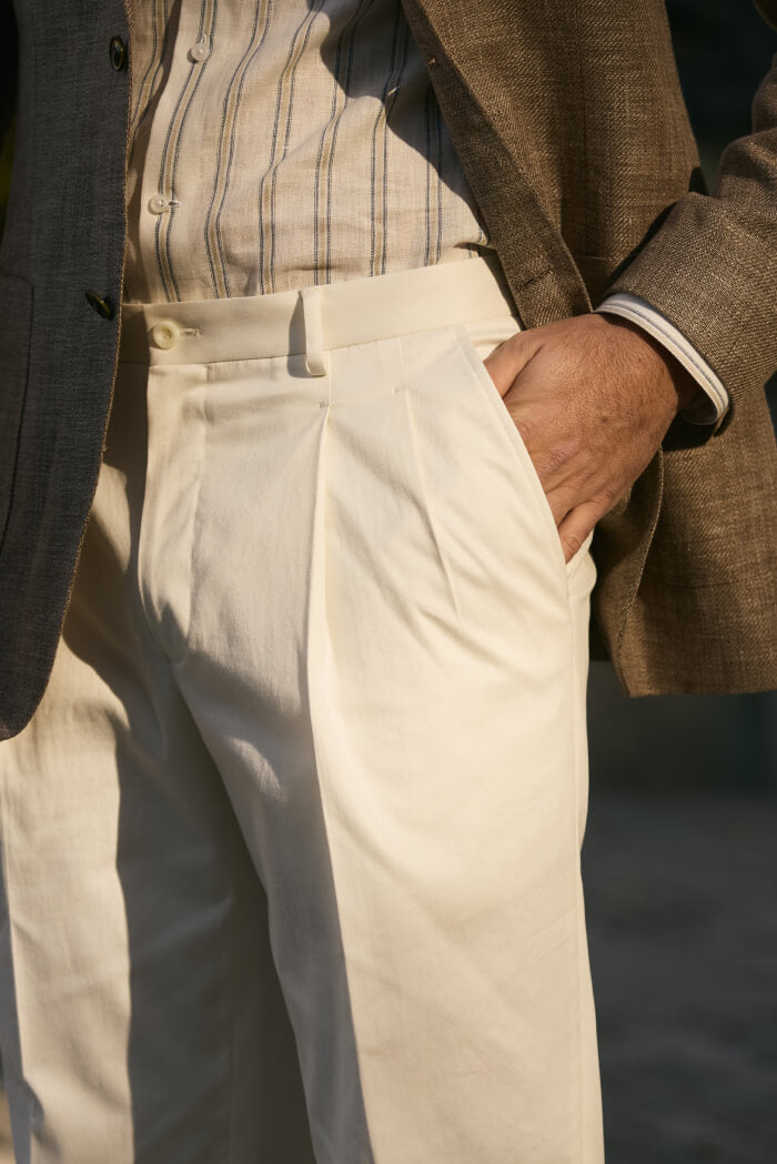 men’s beige pleated trousers with brown blazer and striped shirt smart casual outfit