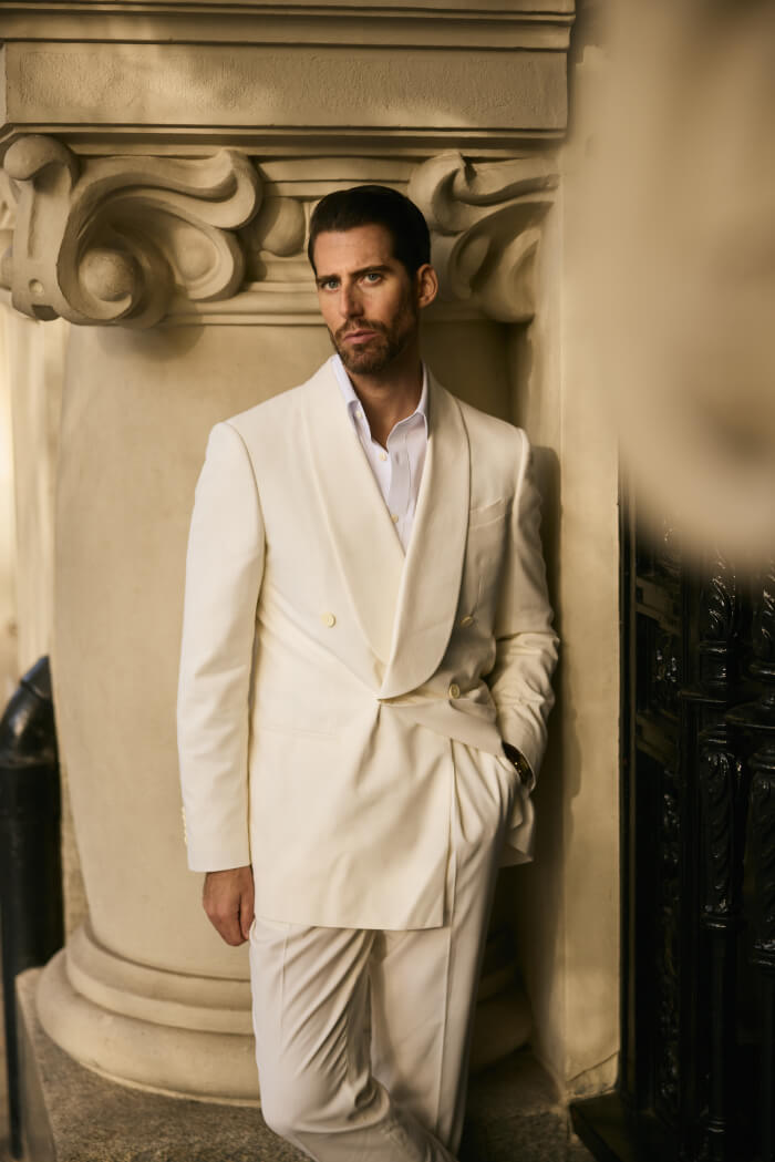 men’s white double breasted suit with relaxed tailoring elegant formal outfit styling
