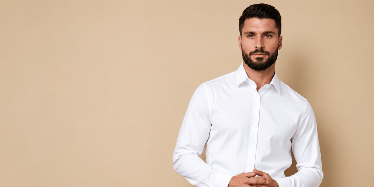 Man wearing a crisp white custom dress shirt with a tailored fit and classic collar.