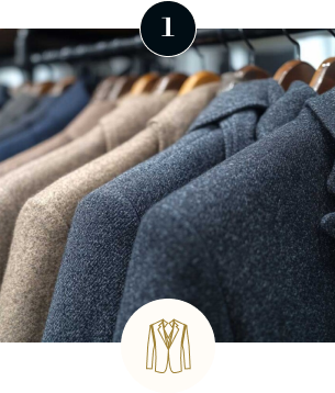 Collection of high-quality suit jackets in neutral tones, highlighting premium tailoring fabrics for bespoke menswear and business attire.