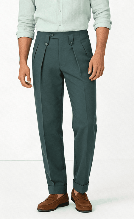 Man wearing green tailored trousers high waist pleated pants formal menswear